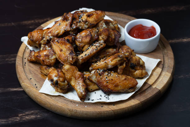 istock delicious fried chicken wings with sauce 1427361708