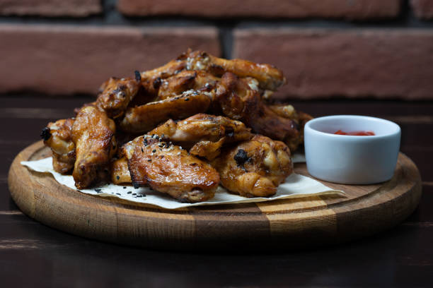 istock delicious fried chicken wings with sauce 1427361767