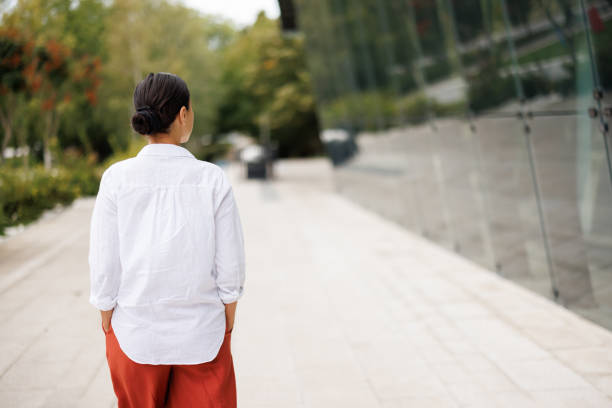 istock Young woman relaxing while walking in the city 1427361954