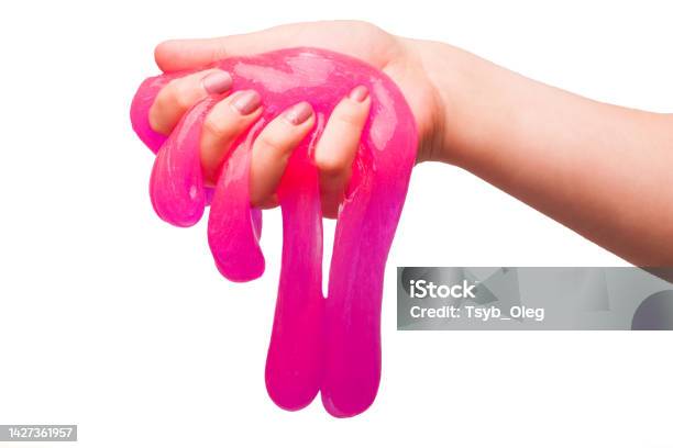 A Toy For Children Mucus And Liquid Flowing On Hand On A White Background Stock Photo - Download Image Now