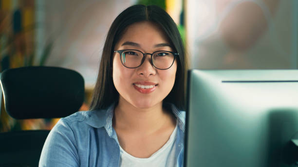 istock Woman in glasses working on pc at home 1427362876