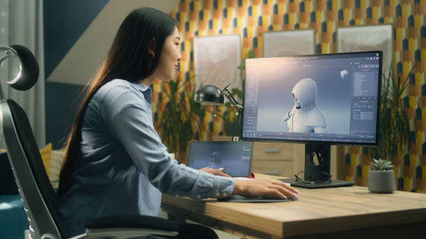 istock Woman creating video game character on pc 1427367807