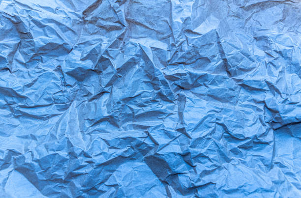 istock crumpled paper art textured background blue colored folded abstract ground 1427369346