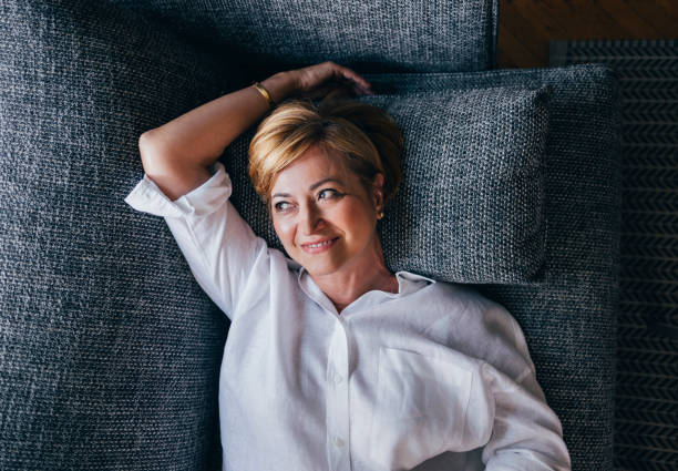 Confident mature woman portrait, studio shot