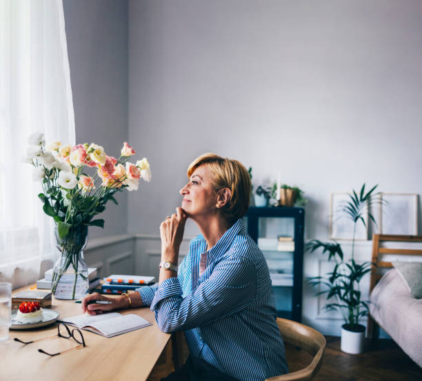 istock A Happy Beautiful Senior Businesswoman Making Some Plans While R 1427370086