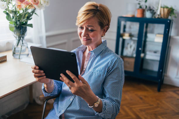 istock A Happy Businesswoman Learning Something Online Using Her Tablet 1427370095