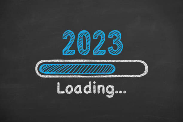 Loading New Year 2023 on Blackboard Background stock photo