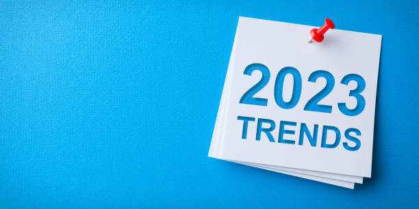 istock Trends 2023 Word in White Sticky Note on Blue Cardboard Background 1427371465