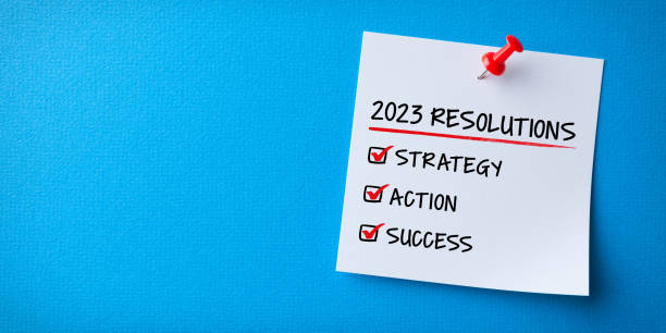 istock White Sticky Note With New Year Resolutions And Red Push Pin On Blue Card Board 1427371473