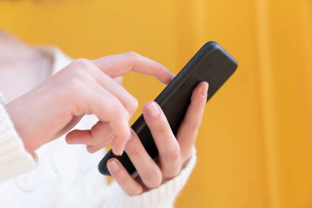 istock Shot of an unrecognizable person using a phone 1427379473