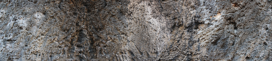 Silver Wall. Dark marble. Rock texture. Black texture. Stone background. Rock pile. Paint spots. Rock surface with cracks. Grunge Rough structure. Abstract texture.