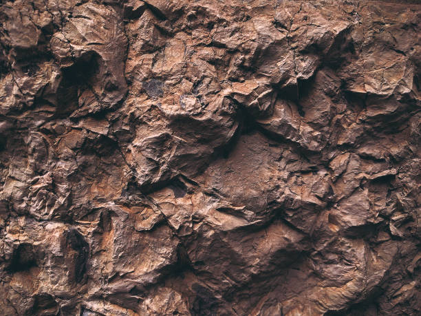 istock Brown texture. Stone background. Rock texture. Grunge Rough structure. Abstract texture. Rock surface with cracks. Rock pile. Paint spots wall. Wall marble. 1427382554