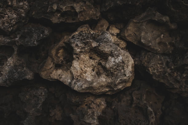istock Brick brown Wall. Rock pile. Rock background. Rock texture. Stone background. Paint spots. Rock surface with cracks. Grunge Rough structure. Abstract texture. 1427383290
