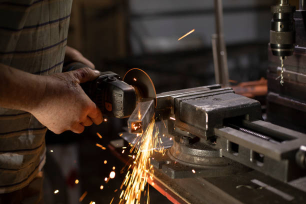 istock Metal treatment. Grinding of steel. Sparks from disk. Work in workshop. 1427384138
