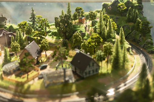 Toy Town. Model of village in mountains. Terrain model. Surroundings for railway. Simulation of territory.