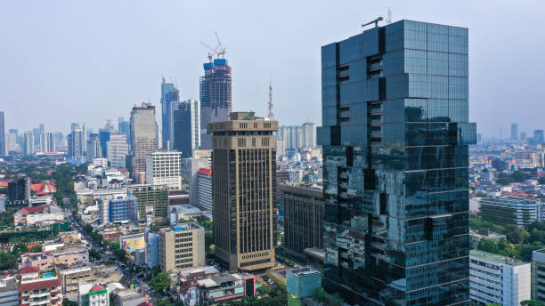 istock Futuristic design skyscraper. Modern architecture scrapper building on Thamrin Street in Jakarta 1427390243