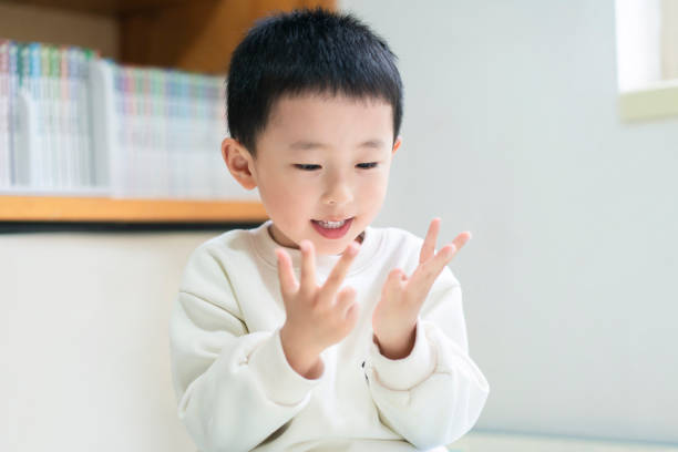 A Chinese baby counting fingers