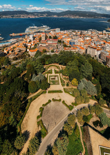 Drone aerial top down view of Monte do Castro park in Vigo, Spain overlooking the bay Drone aerial top down view of Monte do Castro park in Vigo, Spain overlooking the bay vigo stock pictures, royalty-free photos & images