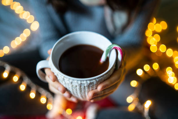 istock A cup of black coffee held up by a pair of hands 1427406055