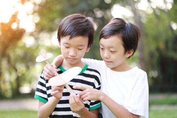 istock Young boy playing with airplane toy 1427410009