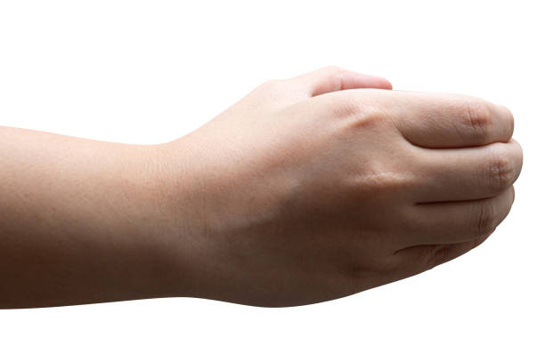 istock isolated of a woman's hand holding something. 1427431289