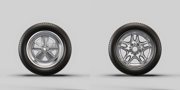 Car wheels on white background. Isolated car tires with shiny rim from front view. 3d rendering, nobody
