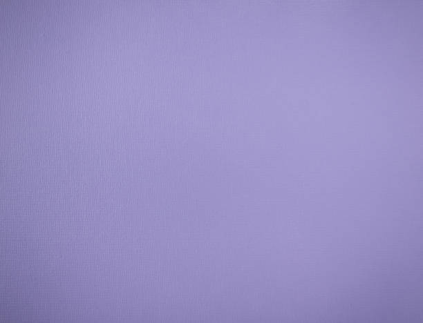 istock fine-textured shiny background of lavender color with vignette 1427444596