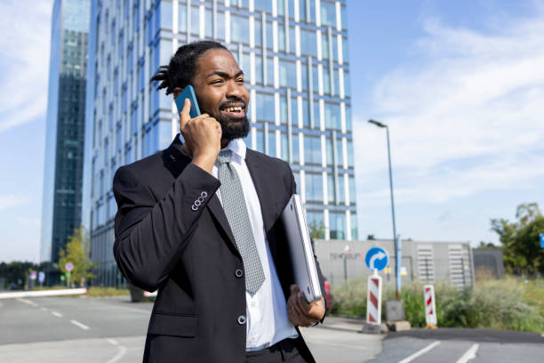 istock Cheerful businessman having a phone conversation 1427447059