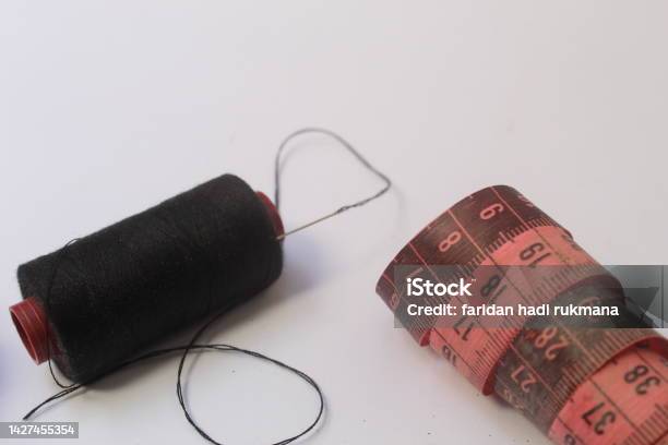 Black Thread And Needle And Fabric Meter Stock Photo - Download