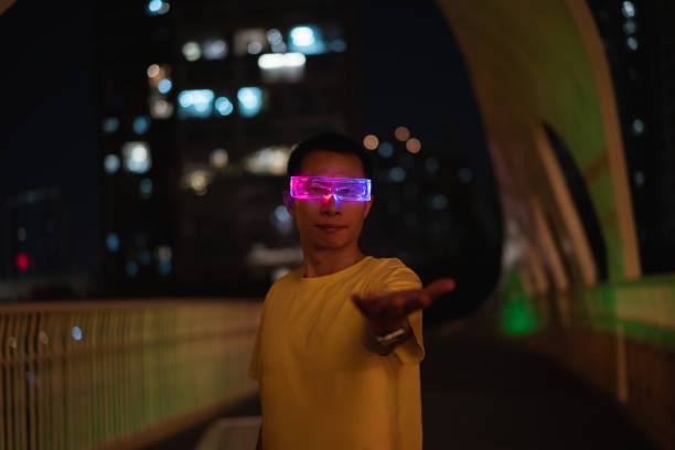 istock Business man wearing glowing smart glasses at night 1427457231