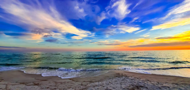 istock Turquoise Waves Breaking on the Beach at Sunset 1427460894