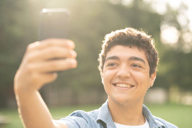 istock Closeup of hispanic boy taking selfie 1427461782