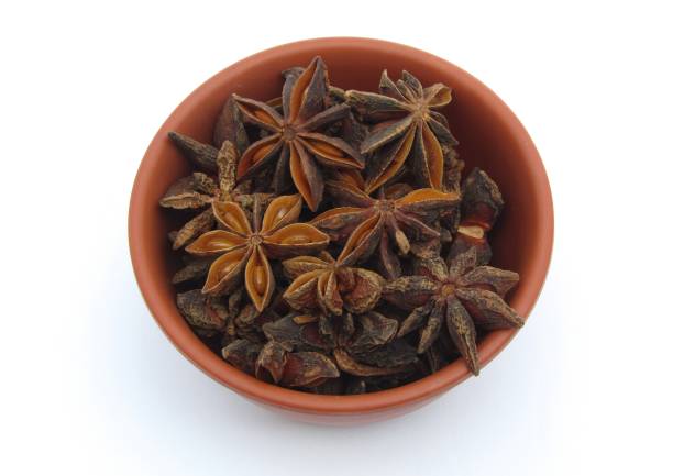 istock Star anise in a bowl on white background 1427462461