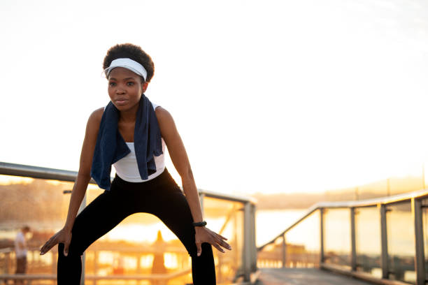 istock Beautiful African woman stretching after training. 1427465730