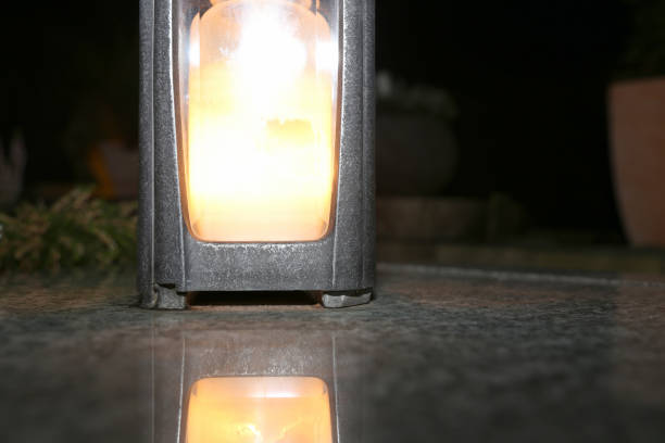 Lighting candles for the dead on All Saints Day