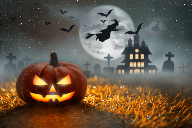 istock Spooky Halloween Pumpkin in graveyard at moonlight. Halloween Party and Celebration Concept. 1427467472