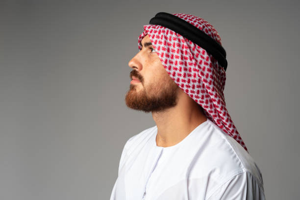 istock Portrait of young Arab man on gray background in studio 1427468158