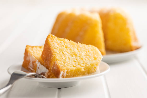 Sweet sponge cake. Bundt cake on plate on the white table.