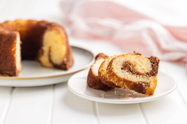 istock Sweet sponge cake. Bundt cake on plate on white table. 1427473022