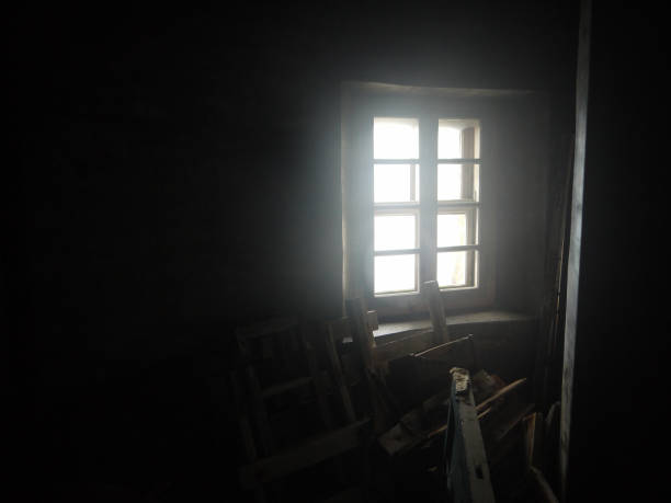 istock Bright Sunlight coming through the window to the dark room 1427473422