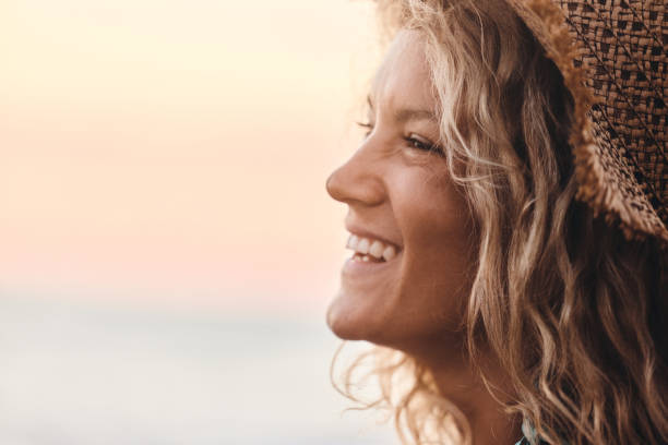 istock Happy woman with a straw hat in summer. 1427474539