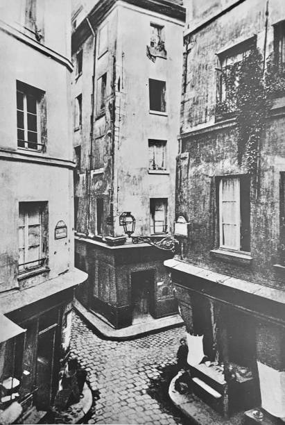 istock Paris cobblestone stree and houses, 1866 1427474650