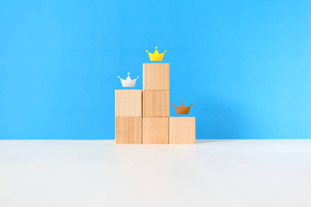 istock Gold, silver and bronze crowns on the podium. 1427476657