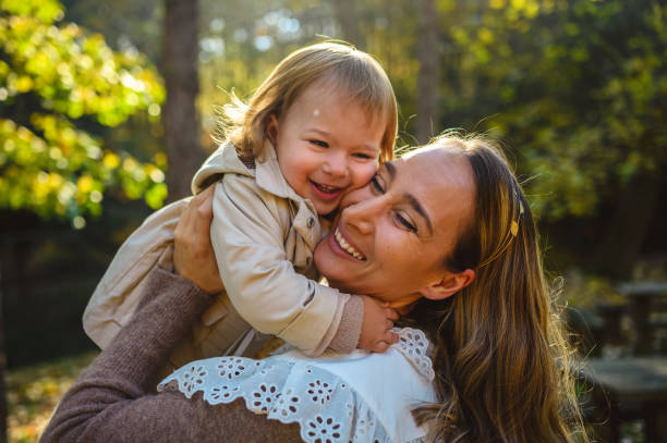 istock Family enjoying autumn in park 1427477638