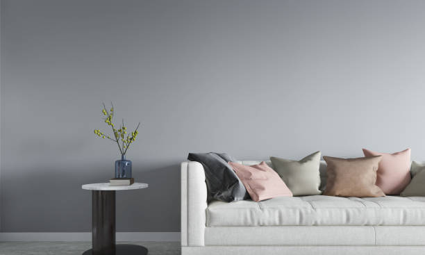 istock Sofa and side table with gray wall background. 3D illustration 1427478824
