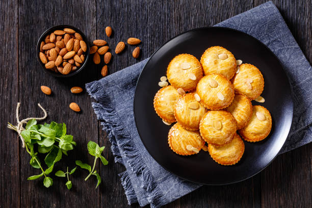 istock almond cookies on black plate, top view 1427478855