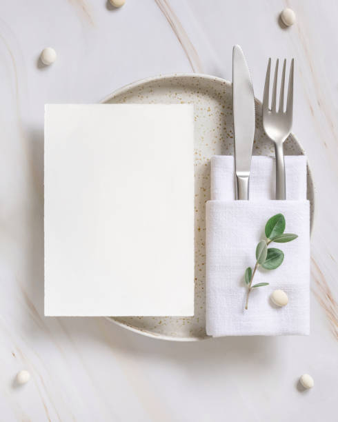 istock Elegant Table setting with a card decorated with eucalyptus branches top view, Wedding mockup 1427481059