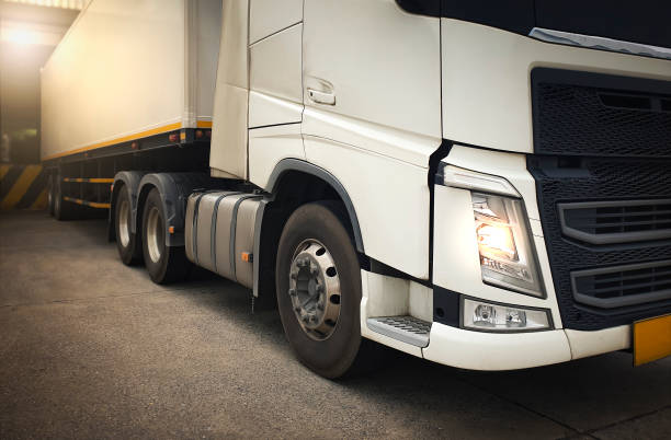 istock Semi TrailerTrucks on Parking. Shipping Container. Delivery Trucks Engine Diesel Lorry Tractor. Industry Freight Trucks Logistics Cargo Transport. 1427483060