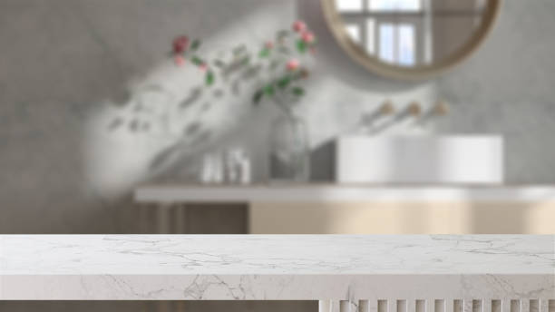 White marble countertop in luxury bathroom with built-in vanity, white wall with sunlight from window White marble tabletop or countertop in luxury bathroom with built-in vanity, white wall with sunlight from window at home for household beauty, personal care product display salon mirror stock pictures, royalty-free photos & images