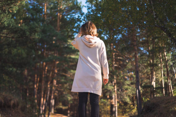 istock young woman in a pine forest 1427492758